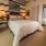 bedroom with a large window and ample space