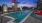 swimming pool on skydeck with ample seating and views of the downtown skyline