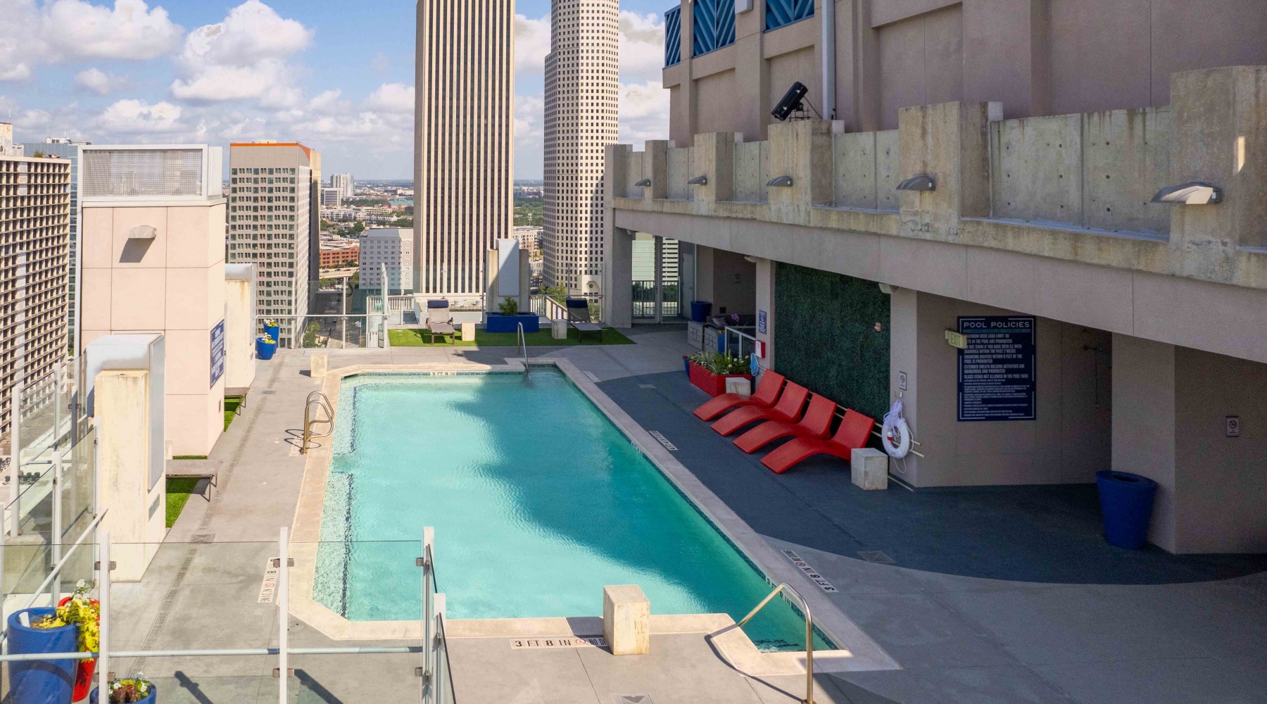 Eclectic. Vibrant. Inspired. pool with skyline views behind