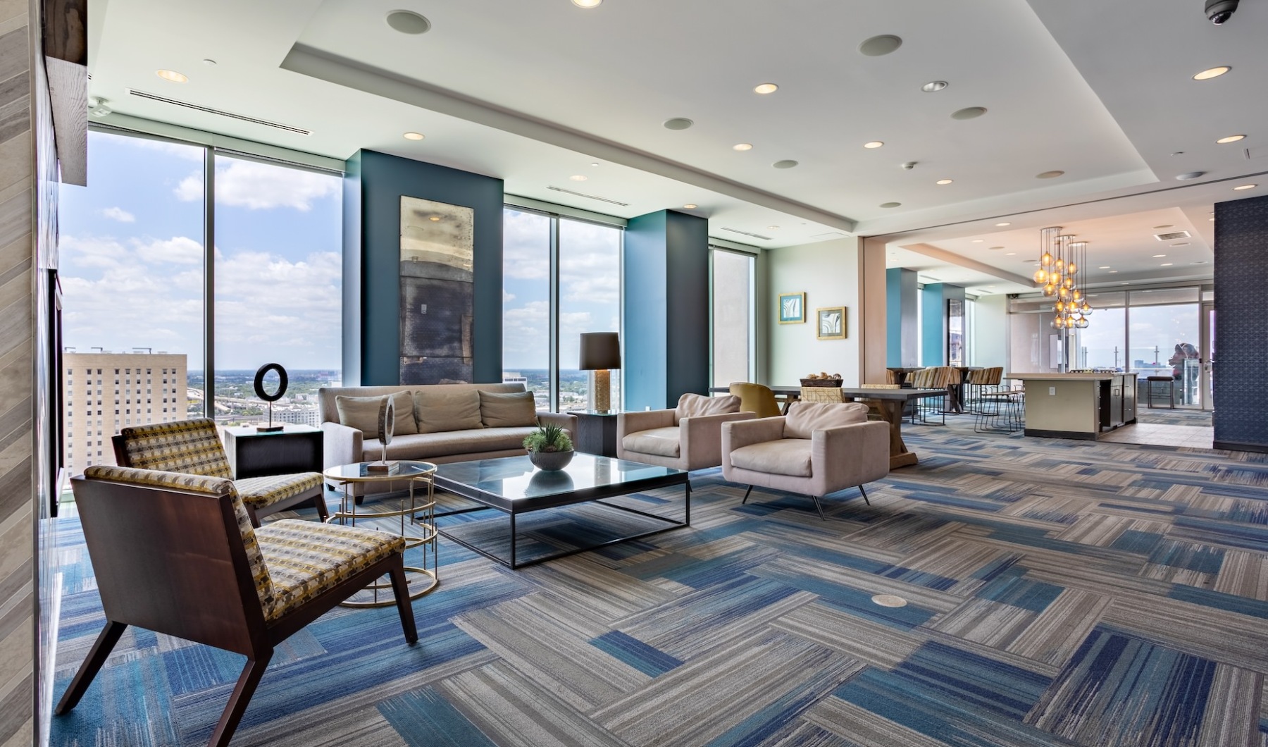 Style Everywhere You Look skylounge with entertainment and seating beside large wall shelves with modern decor