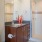 Bath with dual vanity, large mirror and glass enclosed shower