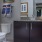 bathroom with a large mirror and easy access to tub