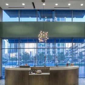 Ground Level Lobby lobby entrance with large open spaces and in between two large pillars and on ground level